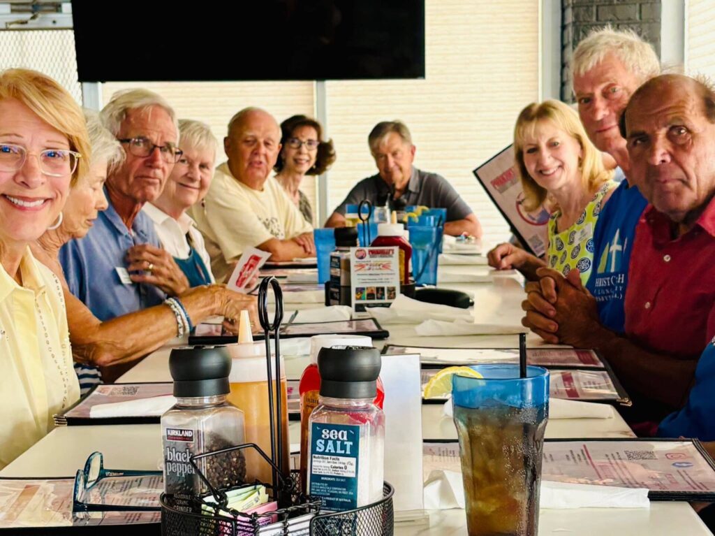 Group of friends gathered around a restaurant table